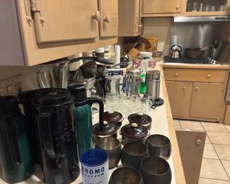 Lots of kitchen stuff - thermos, blender, juicer, mix master, cuisinart mixer, plates, bowls, glasses, pots and pans