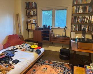 Mid century wall unit, books, canon printer, futon bed, and assorted stuff
