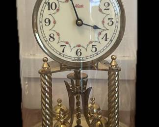 Kundo anniversary clock with papers