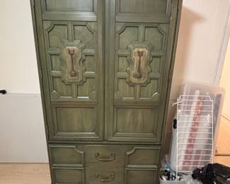 This is a vintage-style armoire with French Provincial influences.