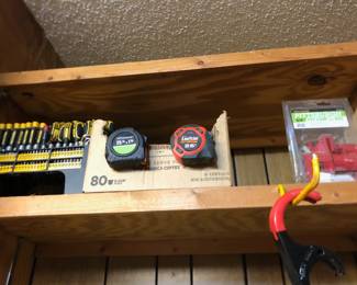 Complete Set on the left, a box of tape measures in the middle