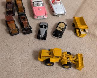 Toy cars, trucks and tractors 