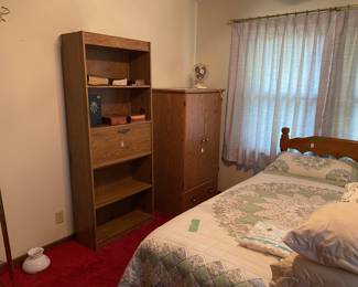 Complete queen bed. Armoire book shelf. Bedding
