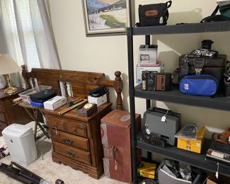 Paper shredder, bedside tables,
queen head board, cameras, video camera , 8mm, viewer