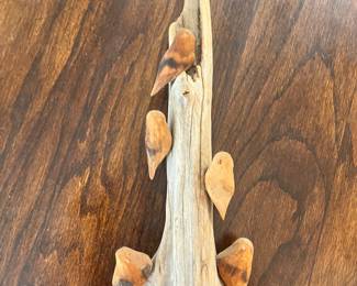 Carved wood birds on drifrwoos