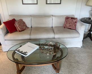 Large off white sofa, glass top coffee table