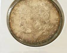 1878 7 Tail Feathers Rev 78 Morgan Silver Dollar Almost Uncirculated Condition with Rainbow Album Toning