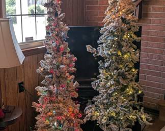 Small flocked lit Christmas trees