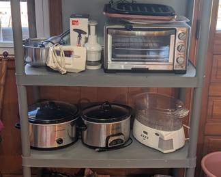 Crockpot, toaster oven,  hand mixer and baking pans