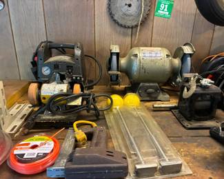 Power tools including bench grinder