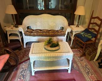 White wicker settee, coffee table and two end tables