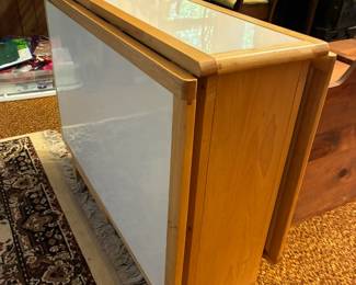 Folding table with chairs stored underneath