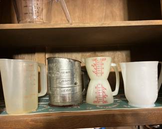 Vintage measuring cups and sifter
