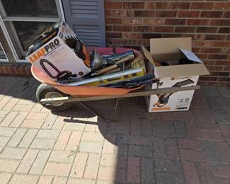 Wheel Barrow Full Of Tools And Leaf Blower Equipment