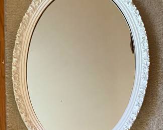 One of three oval mirrors