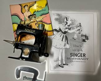 Singer Centennial Sewhandy 
Singer 20 with manual and Singer advertising record

