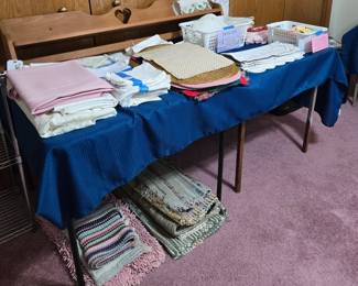Large Assortment of Linens & Textiles: Tablecloths, Napkins; Placemats; Doilies, Rugs; Country Style Wood Wall Rack to Hang Quilts