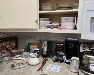Assorted Kitchen & Dining: Vintage Carafes, Electric Coffee Pots, Coffee Makers; Paper Goods; Small Food Processor; Cutting Boards; Corning Ware; Glass Pie Pans; Pyrex Measuring Cups; Choppers and more