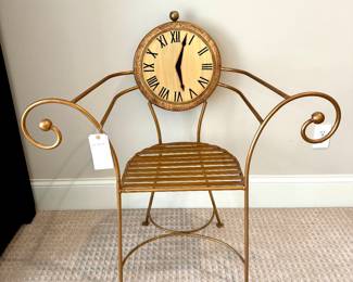 $80 Decorative metal chair with a painted clock, 37L x 15W x 38H.