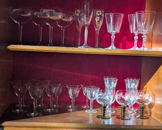 variety of glasses - sets 4 goblets, two hand painted flutes,three water glasses, Floral etched glasses - 4 fluted, 3 small goblets (w/green stem), 4 small brandy glasses and 5 larger brandy/wine glasses **prices vary**