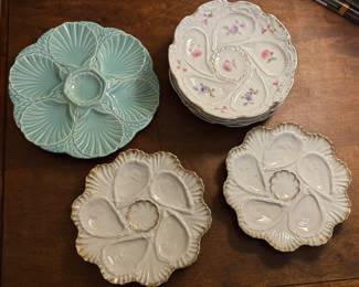 Oyster plates from several eras in several styles. 
