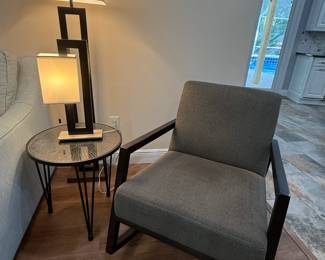 Gray fabric rocking chair, side table, matching floor and table lamps