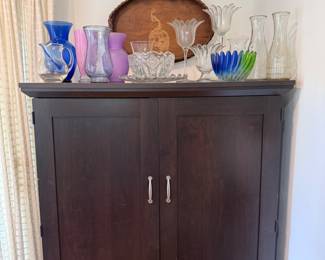 Armoire, various glass items on top