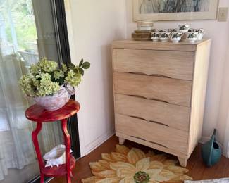 Chest of drawers, flower rug, red plant stand