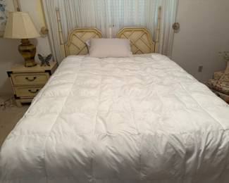 Blonde bedroom nice bed and comforter, matching bedside table