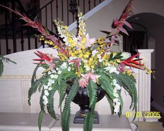 Beautiful flower display with large plastic vase.