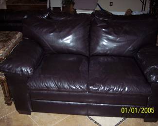 Black Leather love seat couch. Good condition