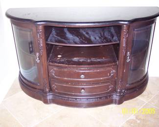 Granite top entertainment center. Top and glass is perfect but the wood has some scratches.