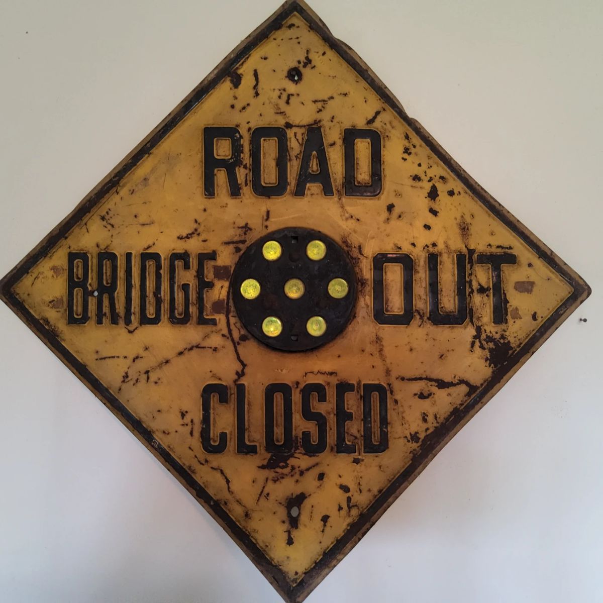 Road sign with cat eyes
