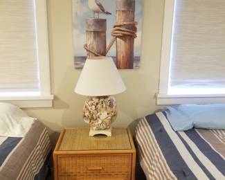 2-drawer wicker nightstand; table lamp