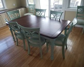 Dining table seats 8; includes two additional leaves which are not shown