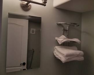 Vanity mirror; vanity light; hotel towel rack