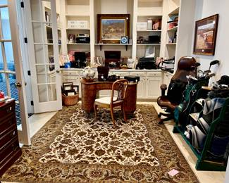 OFFICE FULL OF ELECTRONICS, GOLF, AND LUGGAGE.