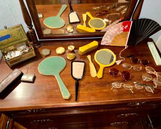 Hand mirrors,old buttons, compacts and glasses