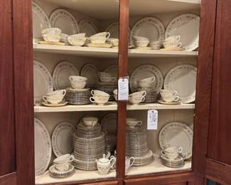 Lenox service in antique blind corner cupboard
