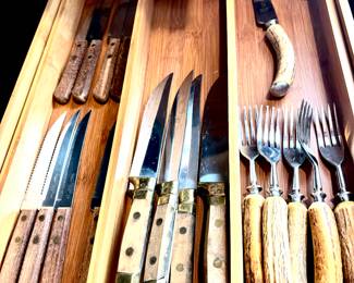 Assorted knives and forks