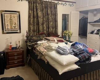Bed, bedding, night stands , art work 