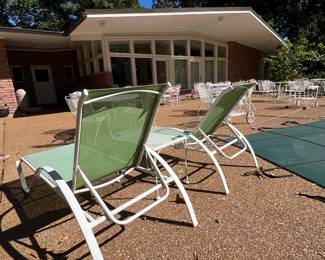 POOL DECK HAS LOTS OF FURNITURE 