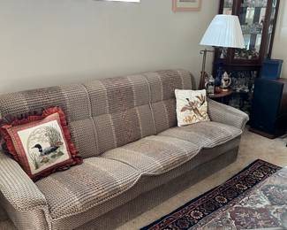 It folds down to a bed Futon type