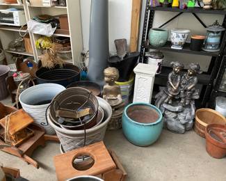 Lots of flower pots and yard art