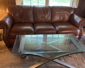 Nice couch that matches the loveseat and a coffee table that is part of a set with two end tables and a sofa table