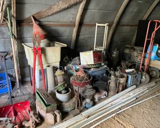 Lots of shop tools, bolt, cutters, cart, milk cans