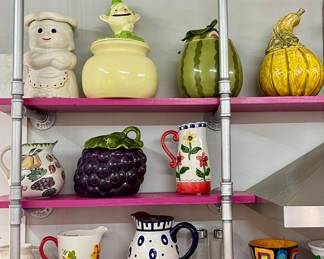 MCCOY “BETSY BAKER” COOKIE JAR, DORANNE OF CALIFORNIA LEPRECHAUN ON POT OF GOLD COOKIE JAR, METLOX POPPYTRAIL WATERMELON COOKIE JAR, MCM CALIFORNIA POTTERY GRAPE COOKIE JAR