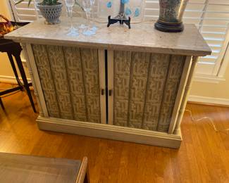 Unique marble topped cabinet.