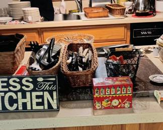 Lots of useful kitchen items dishes knives and more! 