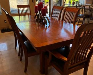 7 foot Oak Dining table with 6 chairs.